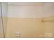 Shower area featuring yellow tile and a functional soap dish at 1330 College Ave, Shelby, NC 28152