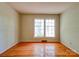 Bedroom featuring hardwood flooring, a window, and light-colored walls at 1330 College Ave, Shelby, NC 28152