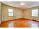 Bedroom featuring hardwood floors and abundant natural light from two windows at 1330 College Ave, Shelby, NC 28152