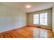 Bright bedroom with hardwood flooring and large windows offering ample natural light at 1330 College Ave, Shelby, NC 28152