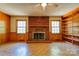 Living room showcasing a brick fireplace and built-in shelving at 1330 College Ave, Shelby, NC 28152