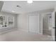 Bedroom with neutral colored walls and carpet, large window, and closet at 1517 Rice Hope Ct, Gastonia, NC 28056