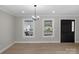 Bright dining area with hardwood floors and large windows at 1517 Rice Hope Ct, Gastonia, NC 28056