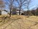 Large backyard with a storage shed, mature trees, and plenty of space for outdoor activities at 1589 E Lakewood Dr, Rock Hill, SC 29732