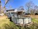 A sprawling backyard featuring an above-ground pool and a large wooden deck at 1589 E Lakewood Dr, Rock Hill, SC 29732