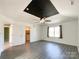 A bright, spacious room showcasing a hard surface floor and a ceiling fan at 1589 E Lakewood Dr, Rock Hill, SC 29732