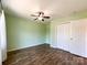 Inviting bedroom features hardwood floors, a ceiling fan and natural light at 1589 E Lakewood Dr, Rock Hill, SC 29732