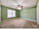 Spacious bedroom with a window, a ceiling fan and carpet at 1589 E Lakewood Dr, Rock Hill, SC 29732