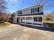 Charming two-story home with gray siding, black shutters, and a covered front porch at 1589 E Lakewood Dr, Rock Hill, SC 29732