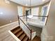 Foyer with hardwood stairs, updated finishes, and a modern light fixture at 1589 E Lakewood Dr, Rock Hill, SC 29732