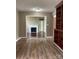 Cozy living area featuring hardwood floors, built-in bookcase and a fireplace at 1589 E Lakewood Dr, Rock Hill, SC 29732