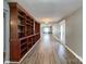 Spacious living room featuring hardwood floors and a built-in shelving unit for storage and decor at 1589 E Lakewood Dr, Rock Hill, SC 29732
