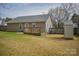View of backyard, wooden deck, shed, siding and grey roof at 1660 Ashridge Rd, Rock Hill, SC 29730