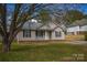 Charming single-story home with a well-maintained lawn and inviting front porch at 1660 Ashridge Rd, Rock Hill, SC 29730