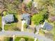 Bird's-eye view of residential homes with well-maintained lawns and mature trees in a suburban setting at 171 Longboat Rd, Mooresville, NC 28117