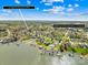 Aerial view of neighborhood and nearby lake with neighborhood amenities and a boat ramp at 171 Longboat Rd, Mooresville, NC 28117
