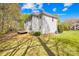 Large backyard with lush lawn, trees, and a deck, perfect for outdoor entertaining at 171 Longboat Rd, Mooresville, NC 28117