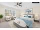 Staged bedroom with large window, ceiling fan, and neutral color scheme at 171 Longboat Rd, Mooresville, NC 28117