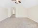 Spacious bonus room with carpeted floors, neutral paint, and a ceiling fan at 171 Longboat Rd, Mooresville, NC 28117