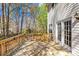 Wooden deck with railing overlooking the backyard, accessible through glass doors at 171 Longboat Rd, Mooresville, NC 28117