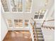 Bright entryway with large windows, staircase, and wood flooring at 171 Longboat Rd, Mooresville, NC 28117