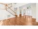 Open entryway featuring hardwood floors, a staircase, and a view into other rooms at 171 Longboat Rd, Mooresville, NC 28117