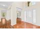 Inviting foyer with hardwood floors, high ceilings, and decorative front door at 171 Longboat Rd, Mooresville, NC 28117
