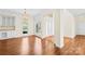 Open-concept living room featuring hardwood floors, ample natural light, and built-in cabinets at 171 Longboat Rd, Mooresville, NC 28117