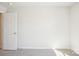 Bright, carpeted bedroom with white walls, trim, and door, offering a clean and simple design at 1748 Braemar Village Dr, Monroe, NC 28110