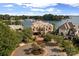Aerial view of the waterfront home showcasing its lush landscaping and serene lakeside setting at 18201 Town Harbour Rd, Cornelius, NC 28031