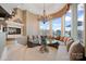 Cozy breakfast nook with built-in seating, water view, fireplace, and stylish chandelier at 18201 Town Harbour Rd, Cornelius, NC 28031
