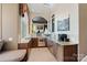 Stylish kitchenette featuring stainless steel appliances, granite countertops, and a charming breakfast nook at 18201 Town Harbour Rd, Cornelius, NC 28031
