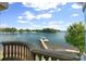 Scenic lake view featuring a private dock and serene waters, as seen from the property at 18201 Town Harbour Rd, Cornelius, NC 28031