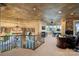 Spacious loft featuring a chandelier, custom railings, sitting area, and office space at 18201 Town Harbour Rd, Cornelius, NC 28031