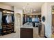 Large walk-in closet with custom shelving, hanging rods, and a center island with granite top at 18201 Town Harbour Rd, Cornelius, NC 28031
