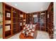 Spacious wine cellar with custom wood racking and display for an extensive collection at 18201 Town Harbour Rd, Cornelius, NC 28031
