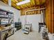 Unfinished basement for storage includes shelving, laundry tub, and white block walls at 19000 Hodestone Mews Ct, Davidson, NC 28036