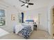 Cozy bedroom with blue accents, large window, and plush carpeting at 19000 Hodestone Mews Ct, Davidson, NC 28036