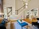 Open living space with a staircase, elegant decor, and plenty of natural light at 19000 Hodestone Mews Ct, Davidson, NC 28036