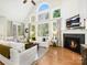 Inviting living room with a fireplace, large windows, and comfortable seating at 19000 Hodestone Mews Ct, Davidson, NC 28036