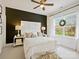 Comfortable main bedroom with a dark accent wall, plush bedding, and natural light at 19000 Hodestone Mews Ct, Davidson, NC 28036
