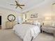 Main bedroom features a tray ceiling, natural light, and a well-organized layout, ideal for relaxation at 19000 Hodestone Mews Ct, Davidson, NC 28036