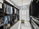 Spacious walk-in closet with custom shelving and elegant lighting, providing ample space and organization at 19000 Hodestone Mews Ct, Davidson, NC 28036