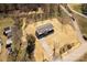 Aerial view of a one-story home with a long driveway and a spacious yard at 2005 Sugar Hill Rd, York, SC 29745
