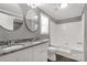 This bathroom features granite counters, dual sinks, and a shower-tub combo at 2005 Sugar Hill Rd, York, SC 29745
