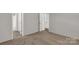 This bedroom has neutral paint, carpet, and open doors at 2005 Sugar Hill Rd, York, SC 29745
