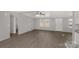 Living room featuring sleek wood-look flooring and white trim at 2005 Sugar Hill Rd, York, SC 29745
