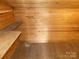 Exposed-beam attic with raw wood walls, wood floors and some built-in shelving at 201 W Rice St, Landis, NC 28088