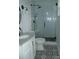 Modern bathroom with marble vanity top, patterned tile floor, and a glass shower at 201 W Rice St, Landis, NC 28088