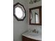Charming bathroom with vintage sink, vanity and octagonal window providing natural light at 201 W Rice St, Landis, NC 28088